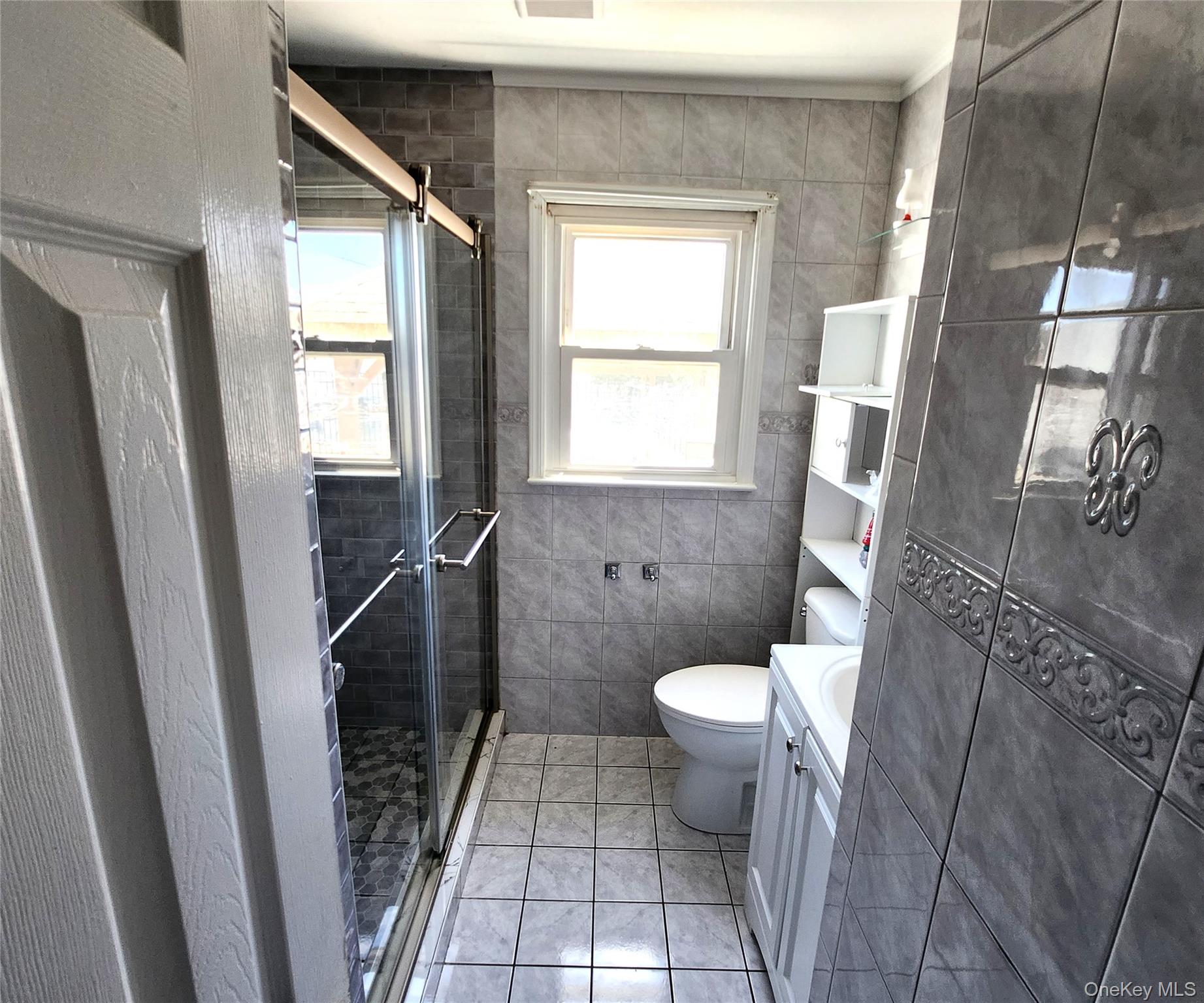 Undisclosed Address West Babylon, NY 11704 - Photo 5 of 12 a bathroom with a sink and a toilet