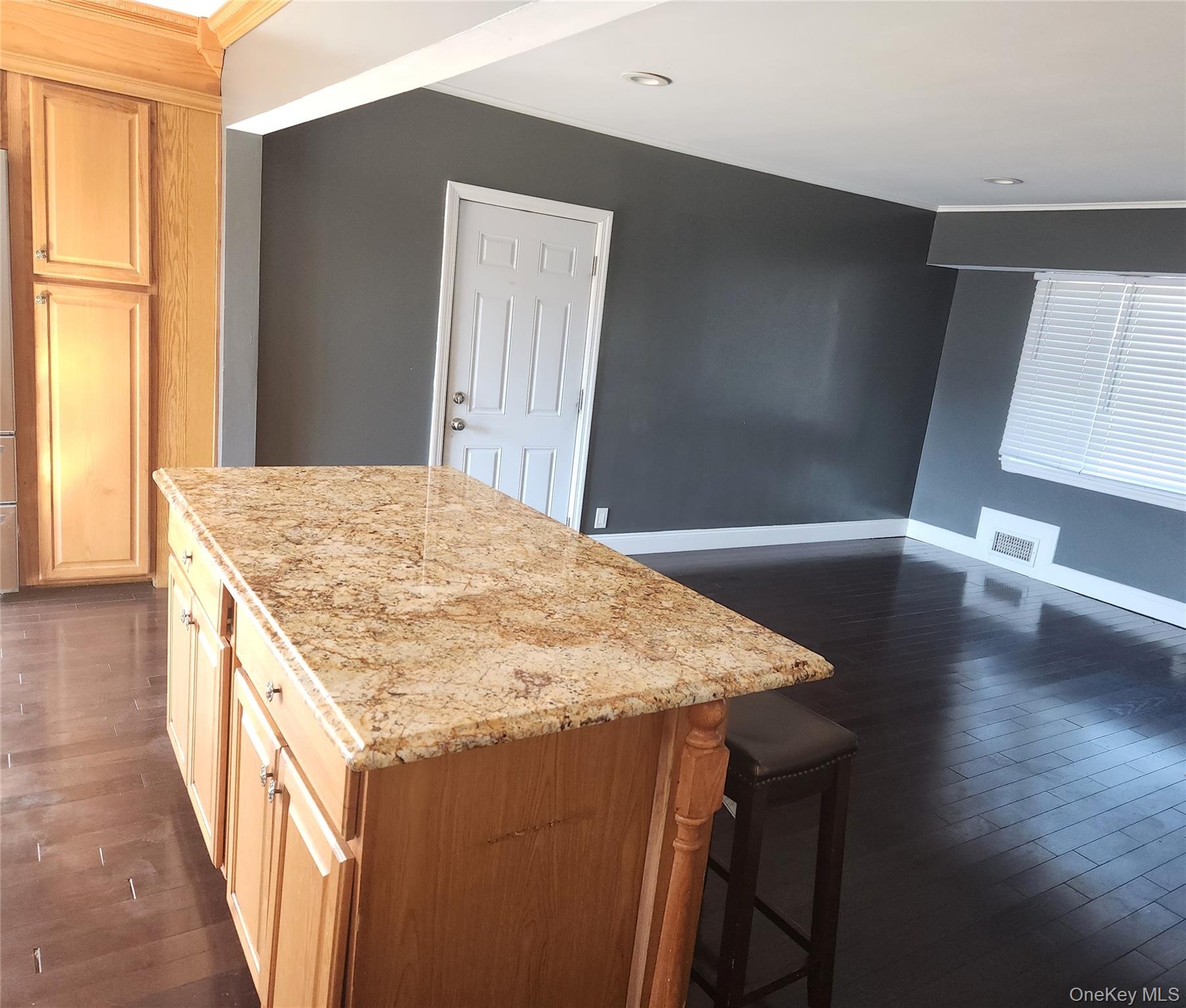 Undisclosed Address West Babylon, NY 11704 - Photo 7 of 12 a kitchen with a stove and a wooden floor