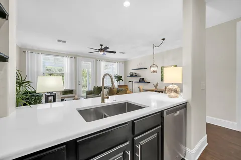 a kitchen with a sink and a refrigerator