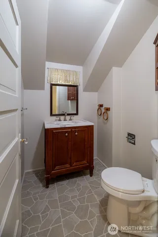 a bathroom with a toilet a sink and bathtub