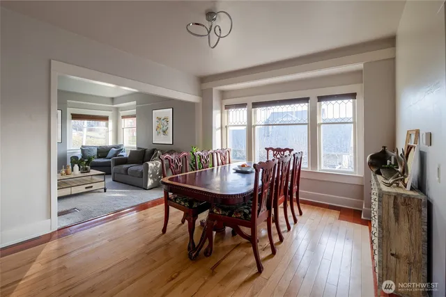 a view of a dining room with furniture window and wooden floor