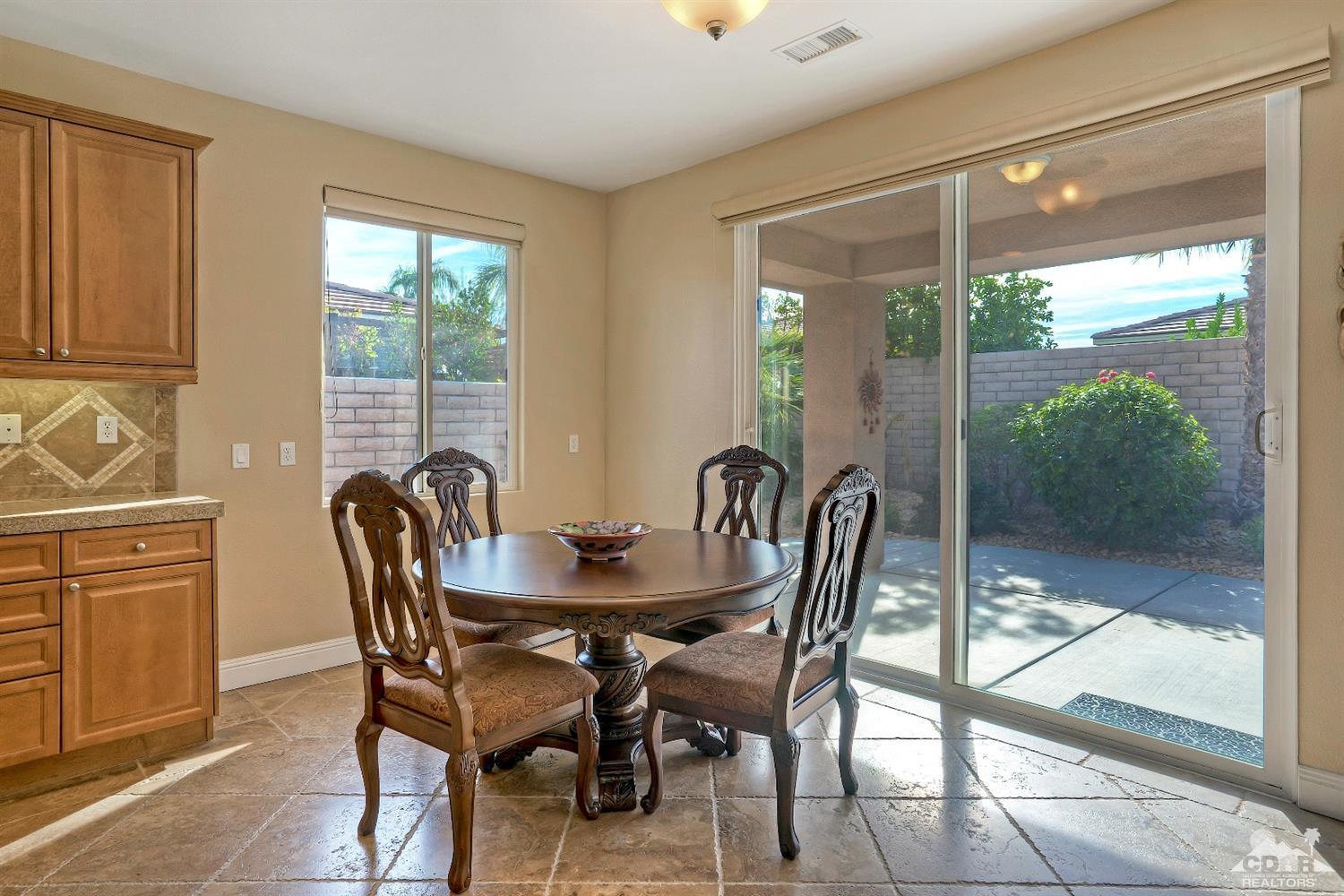 186 Via Milano Rancho Mirage, CA 92270 - Photo 11 of 24 a view of a dining room with furniture window and outside view