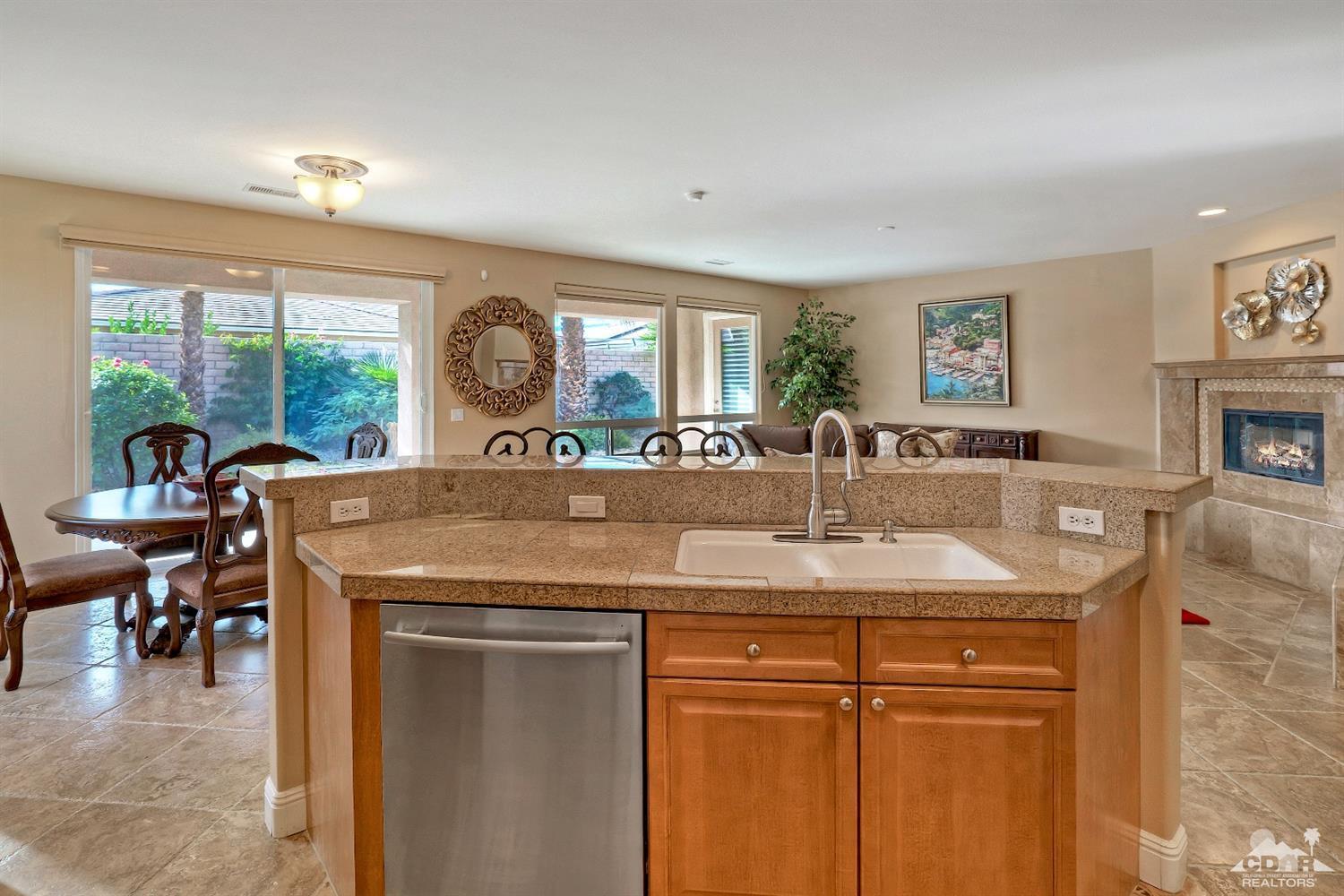 186 Via Milano Rancho Mirage, CA 92270 - Photo 13 of 24 a view of a kitchen area with furniture and a large window