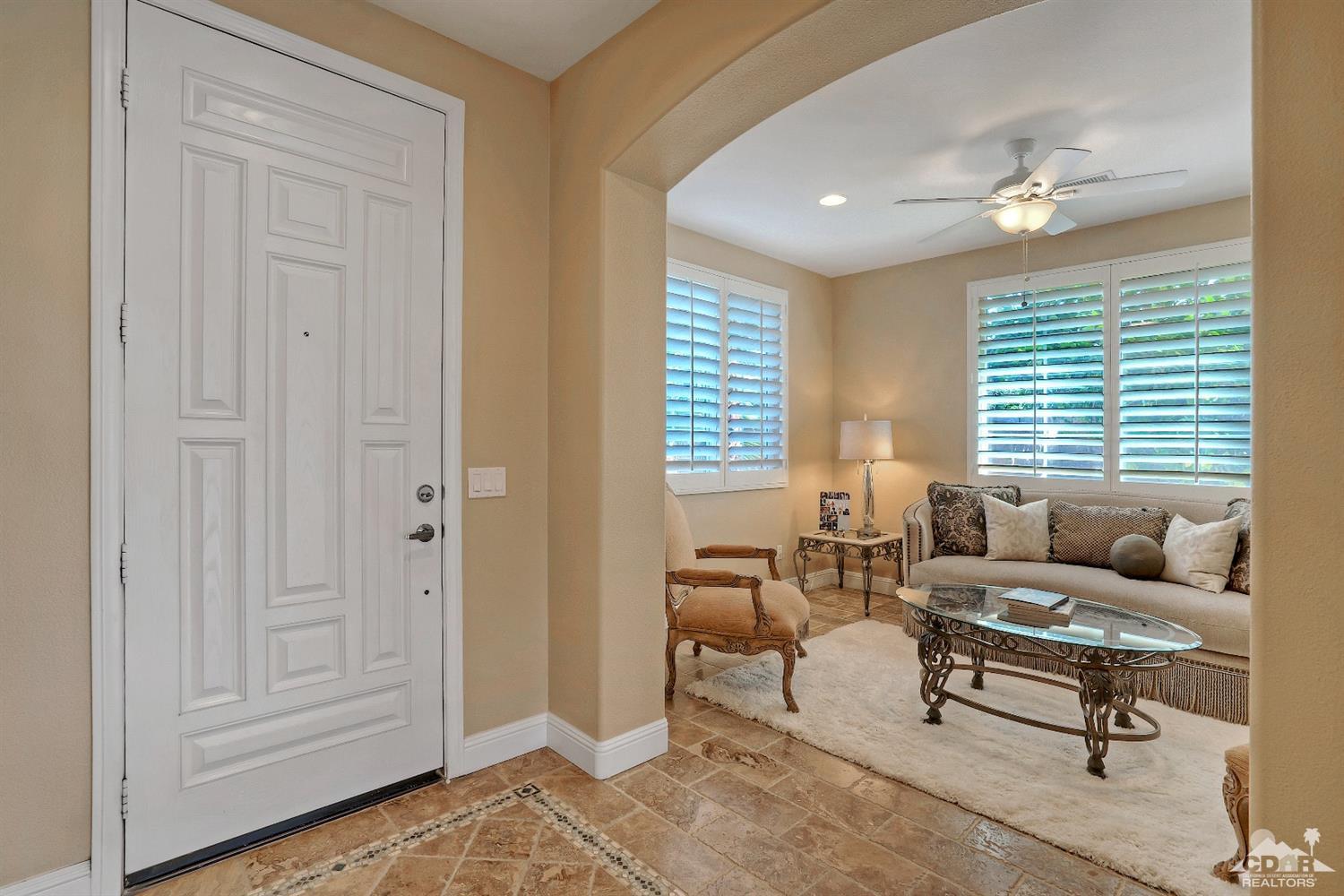 186 Via Milano Rancho Mirage, CA 92270 - Photo 3 of 24 a living room with furniture and a window
