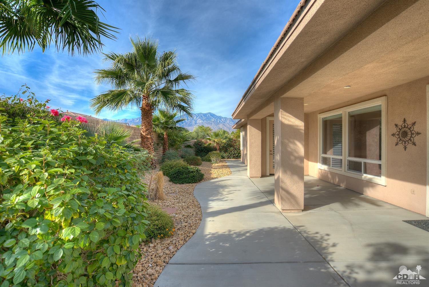 186 Via Milano Rancho Mirage, CA 92270 - Photo 21 of 24 a front view of a house with a yard