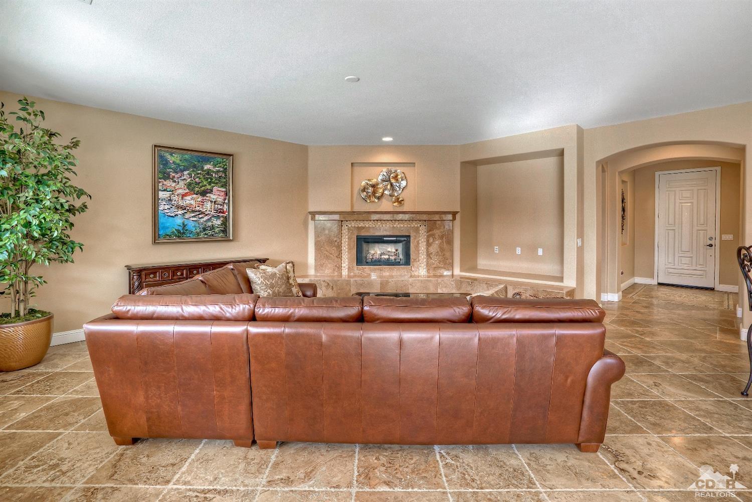 186 Via Milano Rancho Mirage, CA 92270 - Photo 7 of 24 a living room with furniture and a potted plant