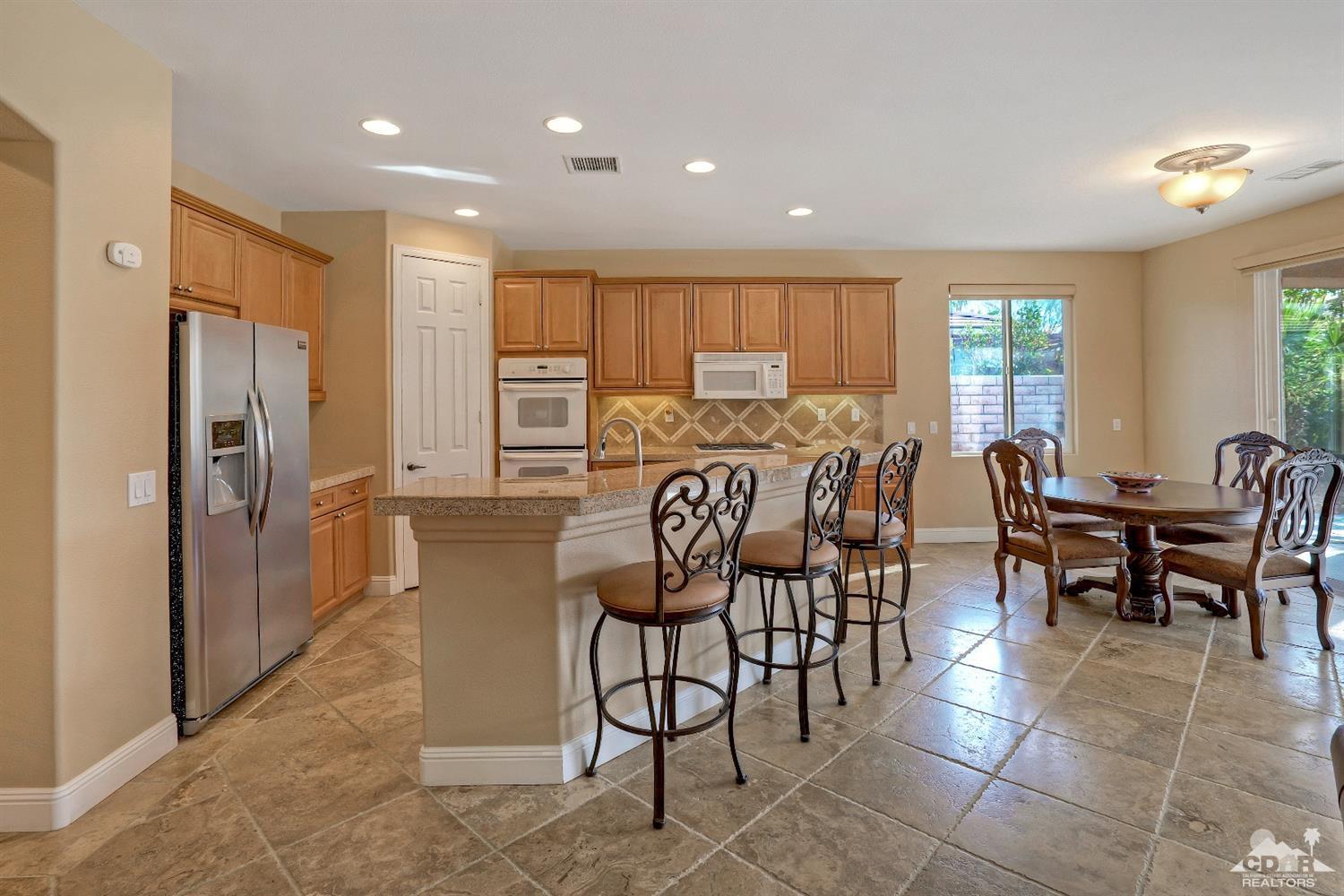 186 Via Milano Rancho Mirage, CA 92270 - Photo 9 of 24 a view of a dining room with furniture