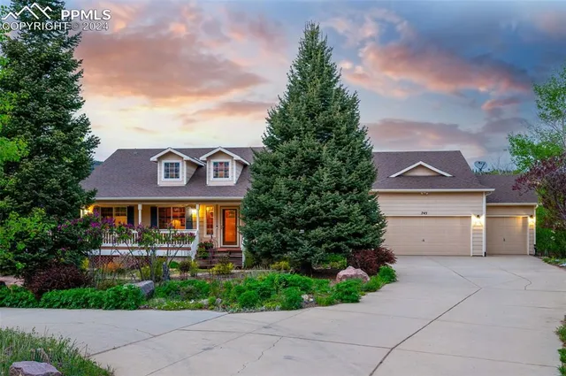 a view of a house with backyard porch and sitting area