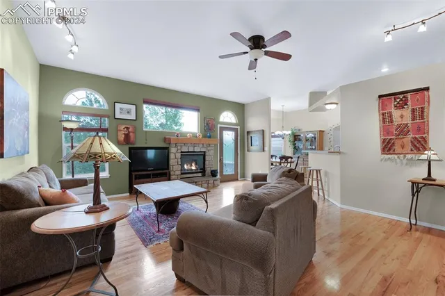 a living room with furniture workspace and a book shelf