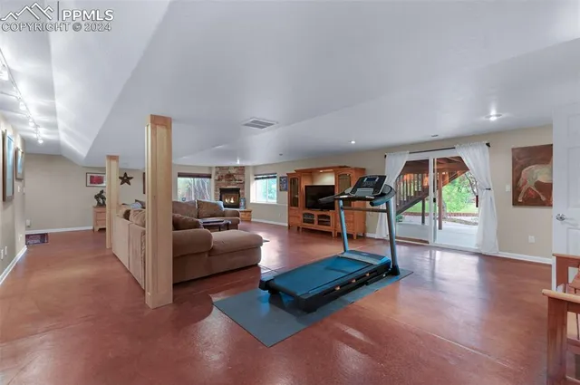 a spacious bedroom with a bed and window