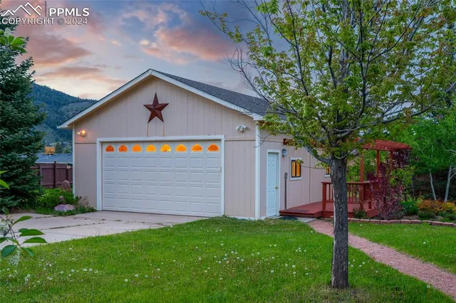 a view of a chair and table in the garden