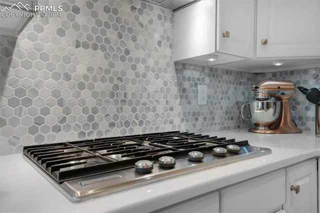a kitchen with stainless steel appliances a refrigerator sink and microwave