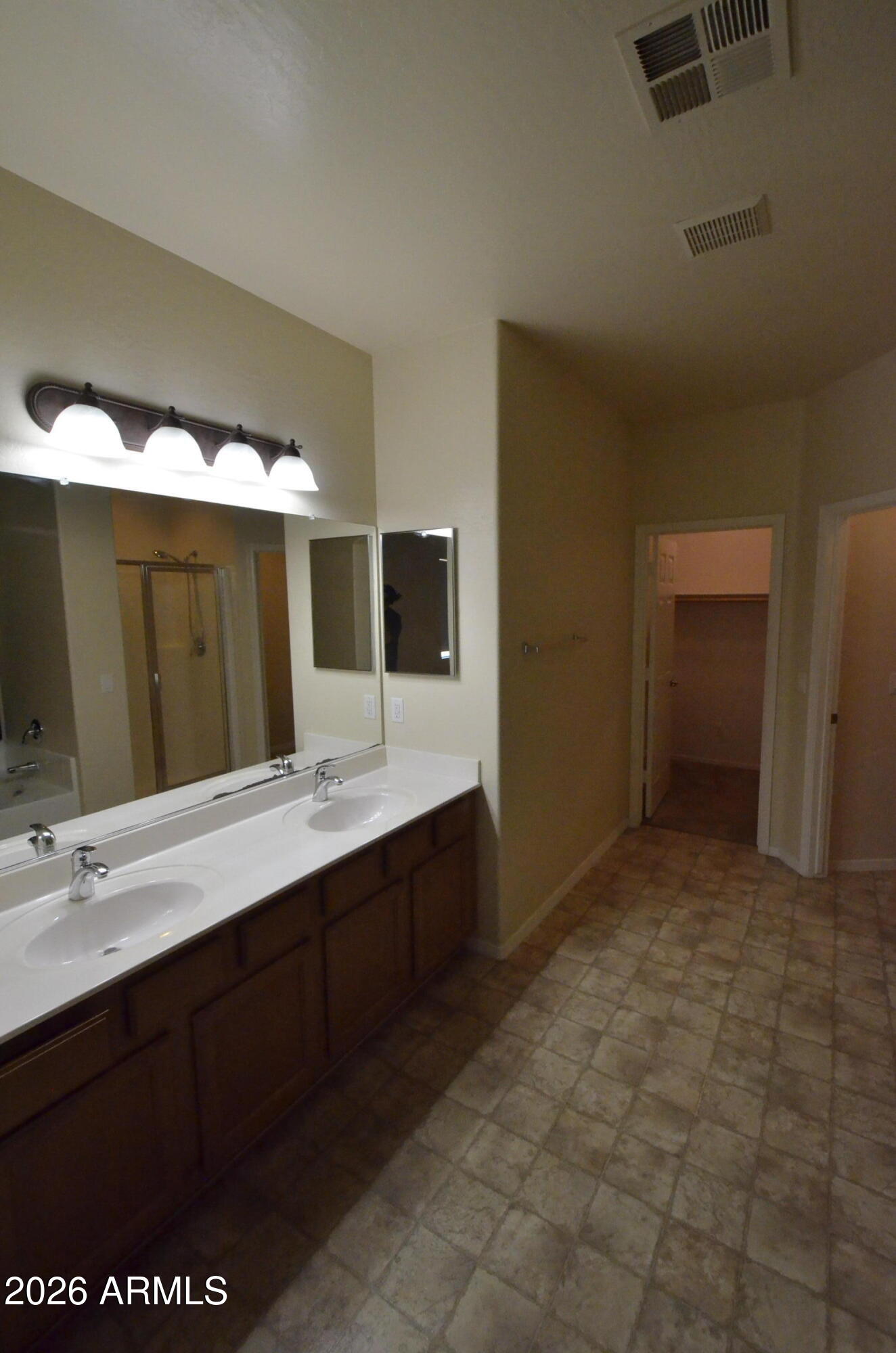 3995 East Trigger Way Gilbert, AZ 85297 - Photo 10 of 23 a bathroom with a sink and a mirror