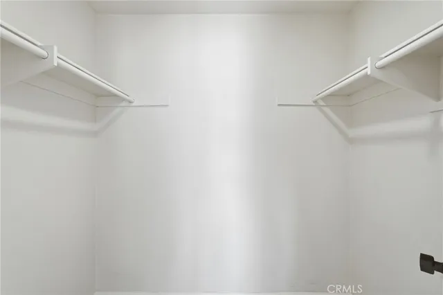 a bathroom with a sink toilet vanity and shower