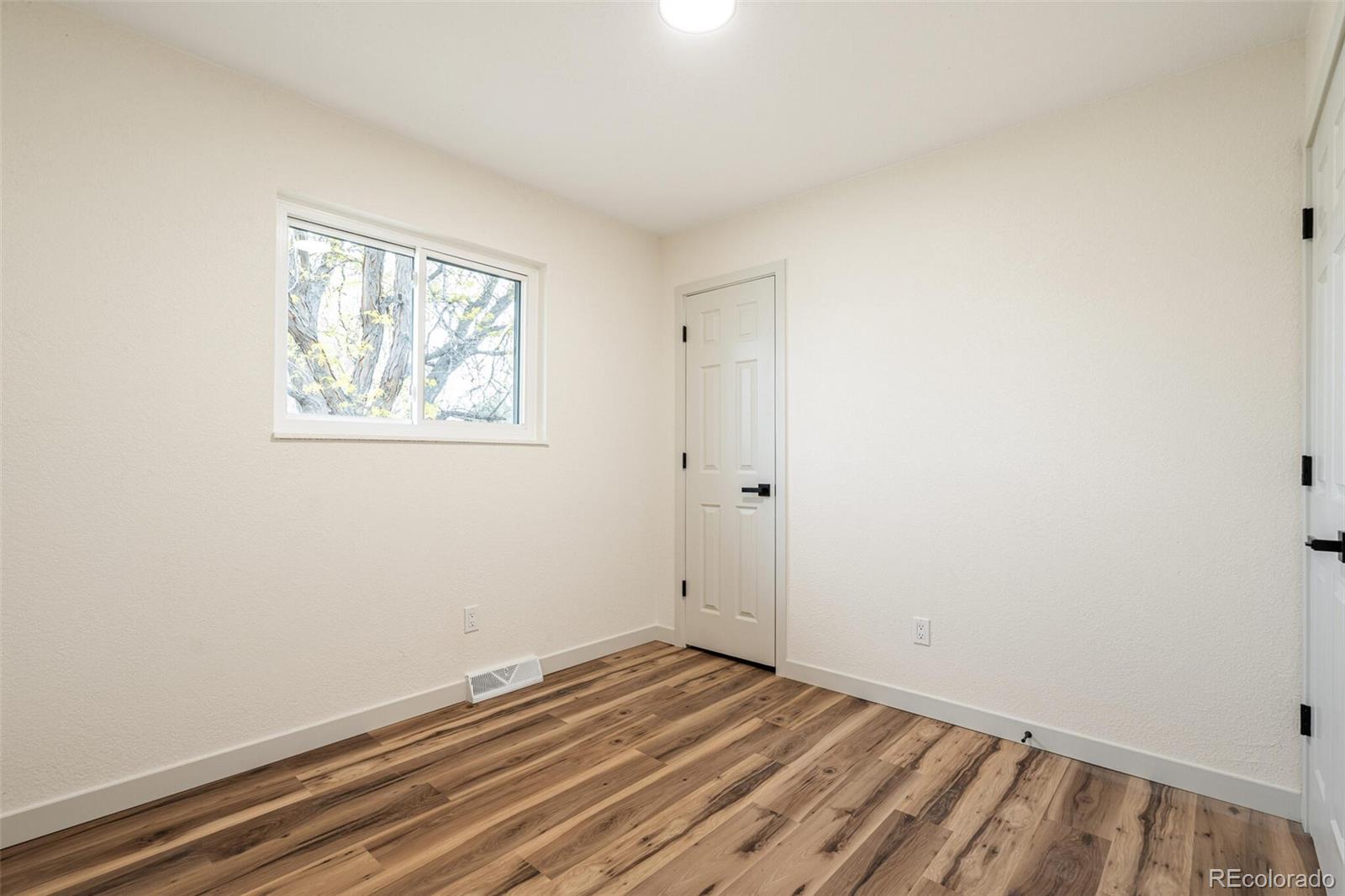 2040 Mable Avenue Denver, CO 80229 - Photo 12 of 25 wooden floor in an empty room