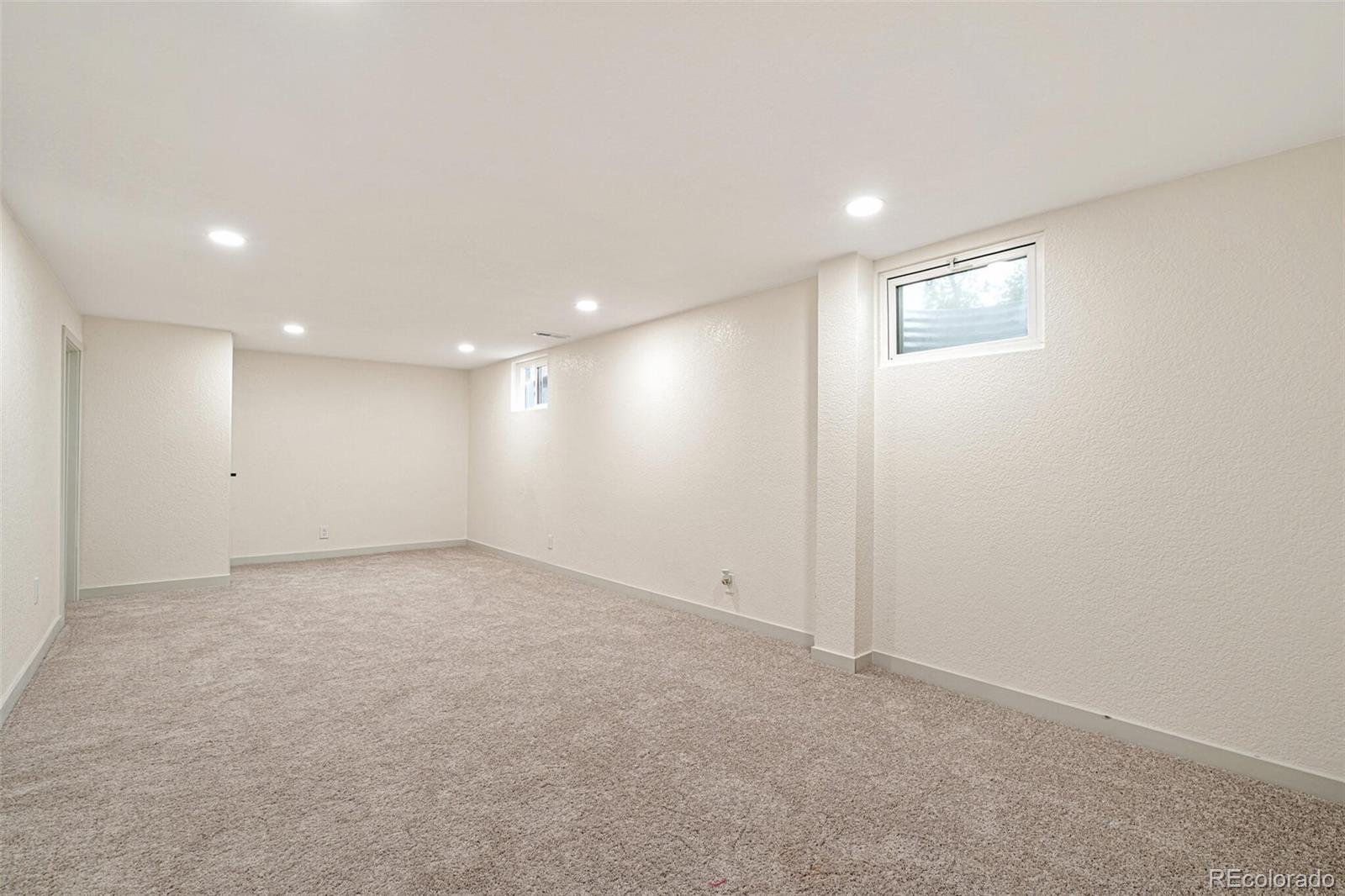 2040 Mable Avenue Denver, CO 80229 - Photo 13 of 25 an empty room with a empty space and windows