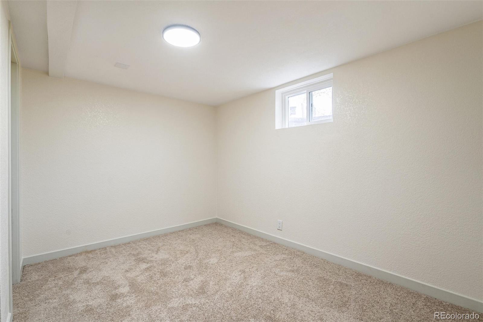 2040 Mable Avenue Denver, CO 80229 - Photo 17 of 25 an empty room with a window