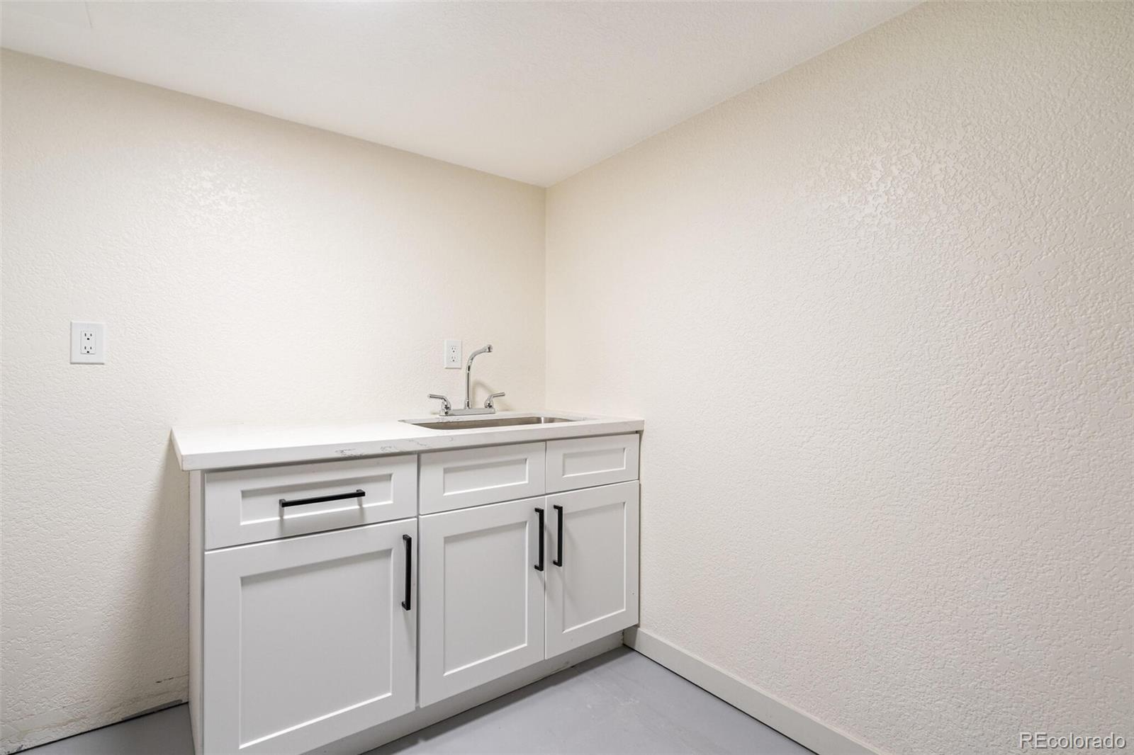 2040 Mable Avenue Denver, CO 80229 - Photo 19 of 25 a view of a storage and utility room with closet