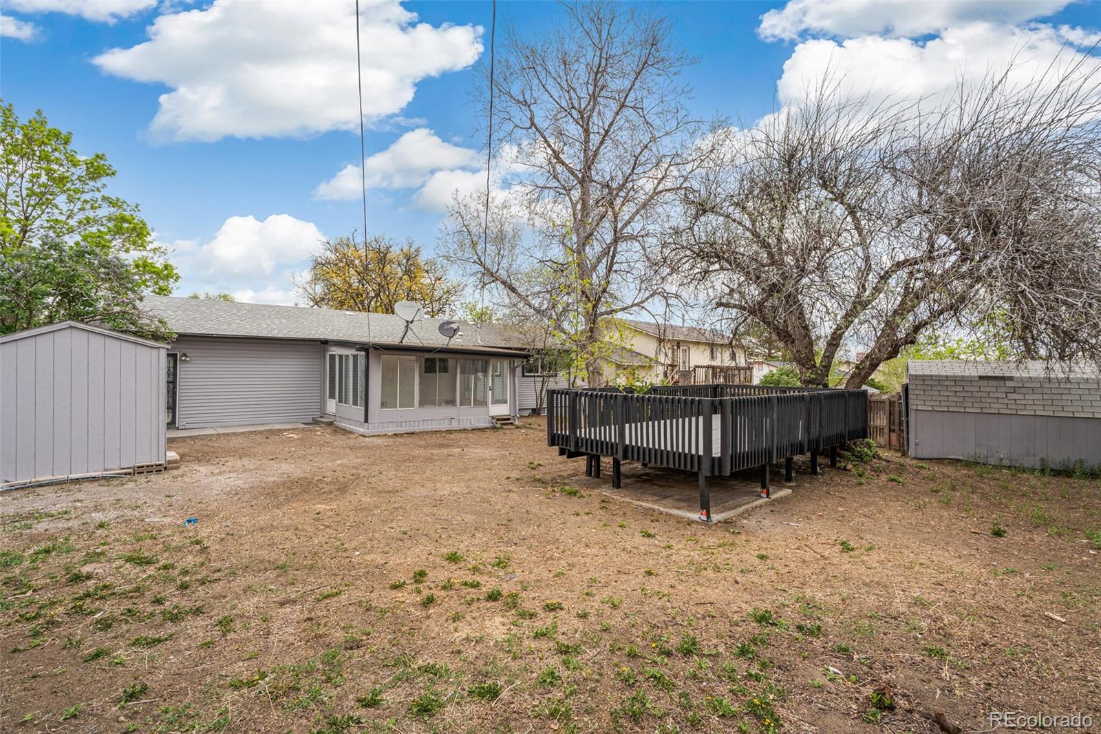 2040 Mable Avenue Denver, CO 80229 - Photo 22 of 25 a view of a house with a yard and garage