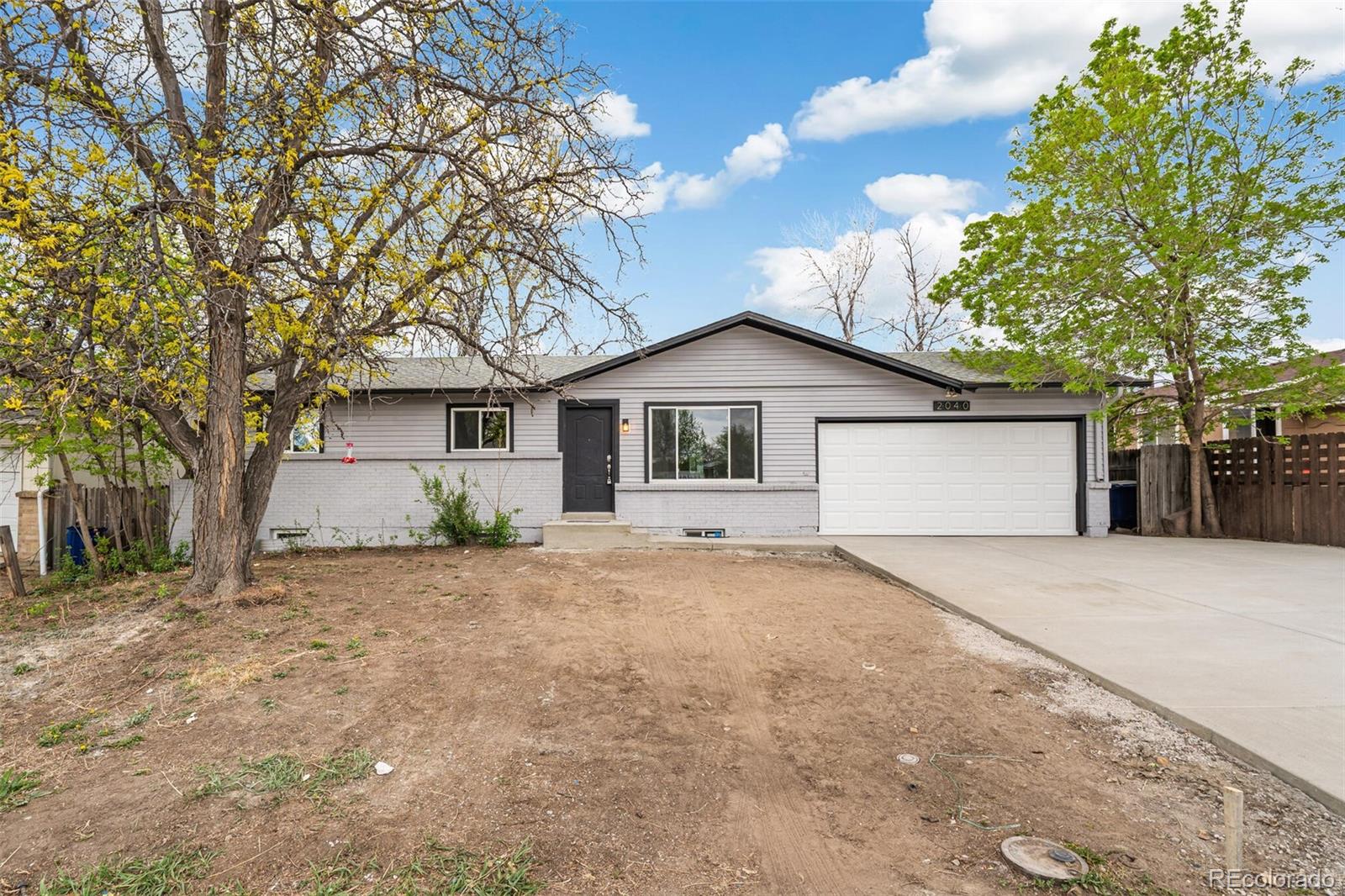 2040 Mable Avenue Denver, CO 80229 - Photo 25 of 25 front view of a house and a yard