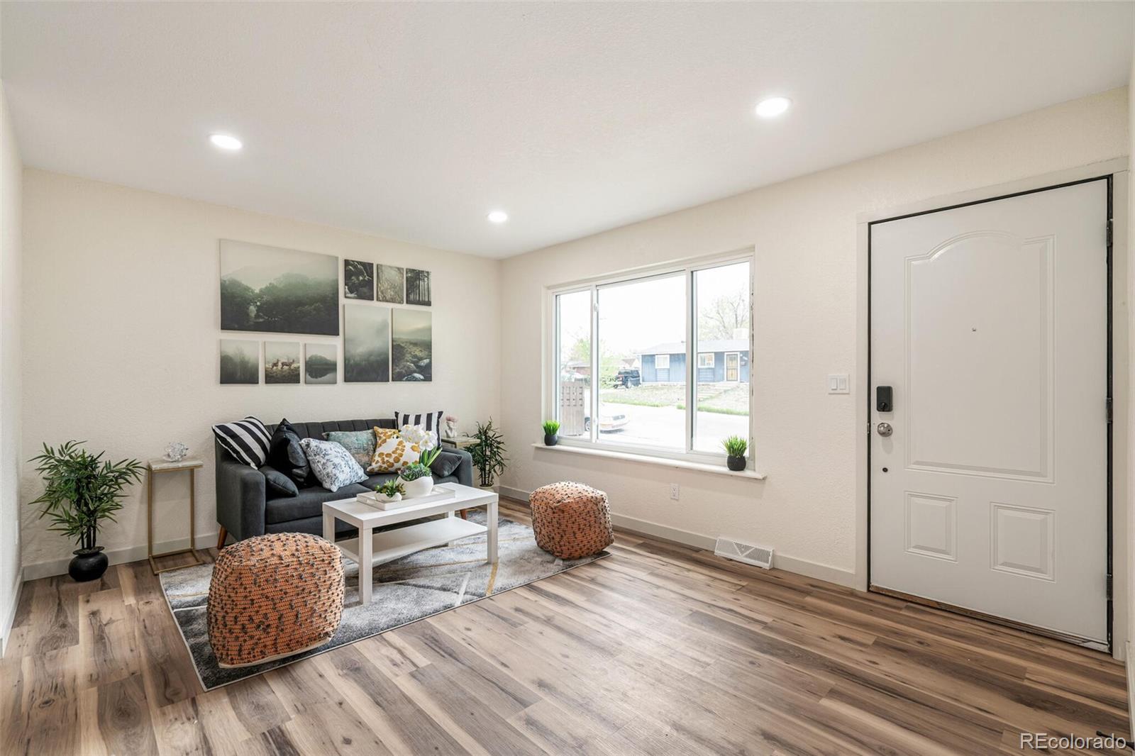 2040 Mable Avenue Denver, CO 80229 - Photo 3 of 25 a living room with furniture and a window