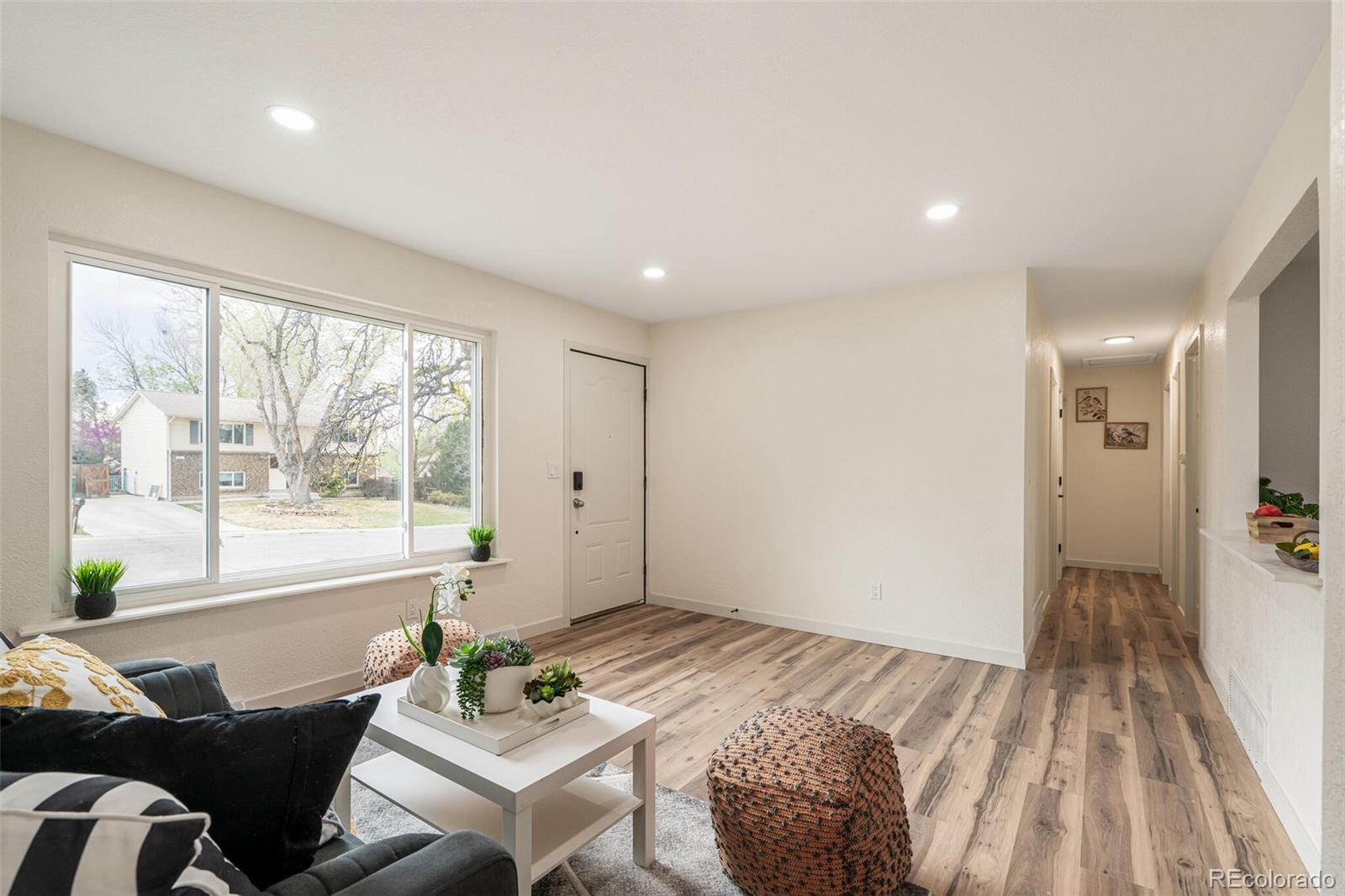 2040 Mable Avenue Denver, CO 80229 - Photo 4 of 25 a living room with furniture and a window