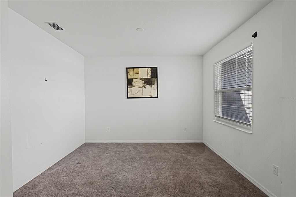 804 Channing Street Winter Haven, FL 33880 - Photo 13 of 31 an empty room with windows