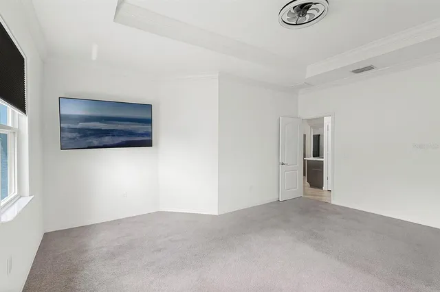a bathroom with a granite countertop tub sink and mirror