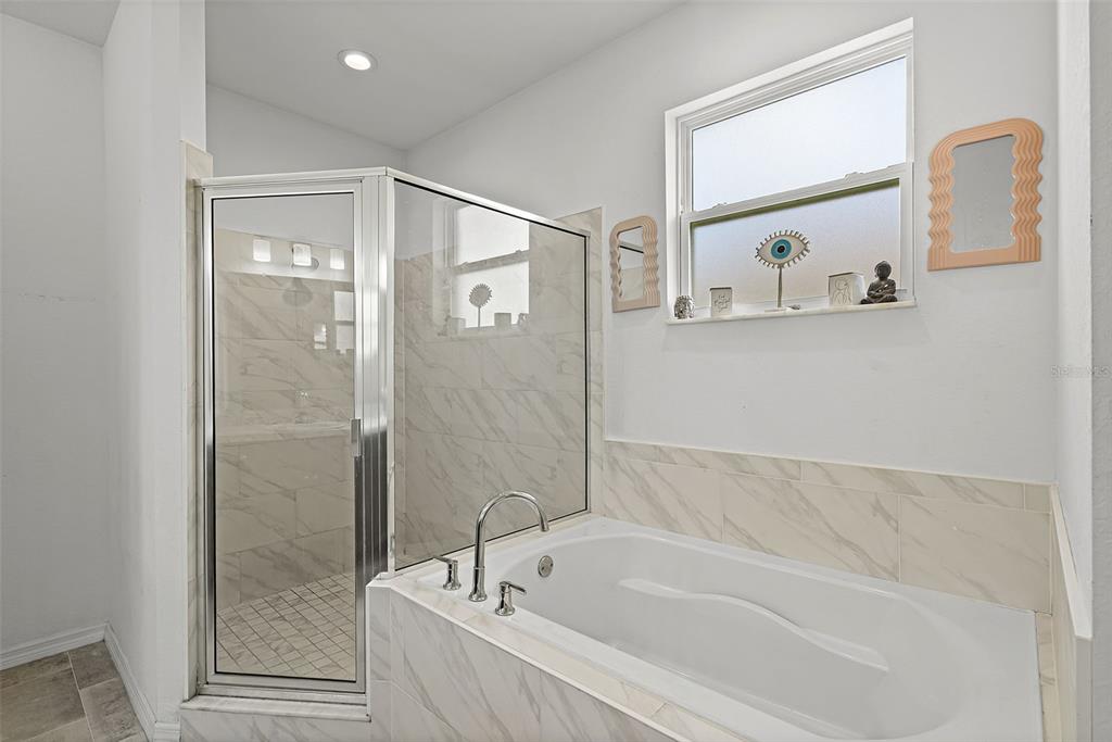 804 Channing Street Winter Haven, FL 33880 - Photo 20 of 31 a bathroom with a bathtub and a shower