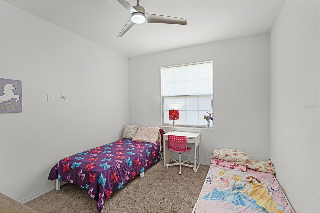 804 Channing Street Winter Haven, FL 33880 - Photo 22 of 31 a bedroom with a bed and a window