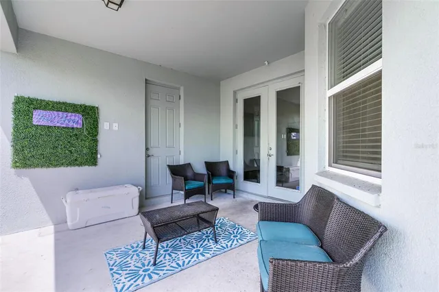 a front view of house with yard and trees in the background