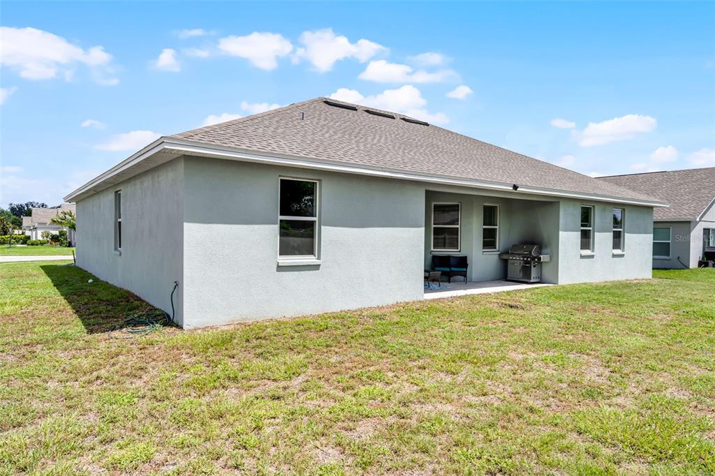 804 Channing Street Winter Haven, FL 33880 - Photo 30 of 31 a front view of house with yard and trees in the background