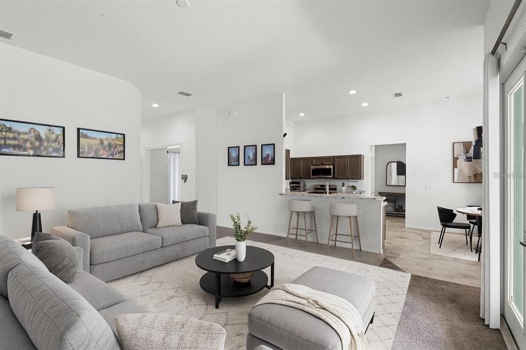 804 Channing Street Winter Haven, FL 33880 - Photo 5 of 31 a living room with furniture and a flat screen tv