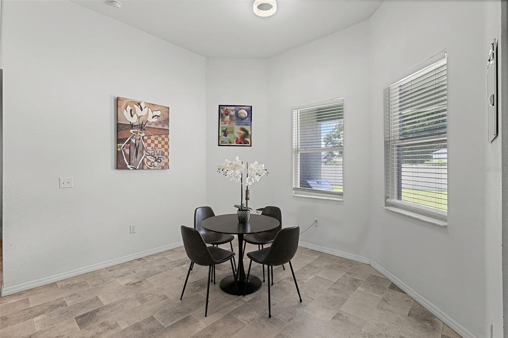 804 Channing Street Winter Haven, FL 33880 - Photo 9 of 31 a dining room with table and chair