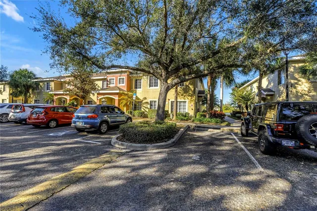a view of a cars in front of a building
