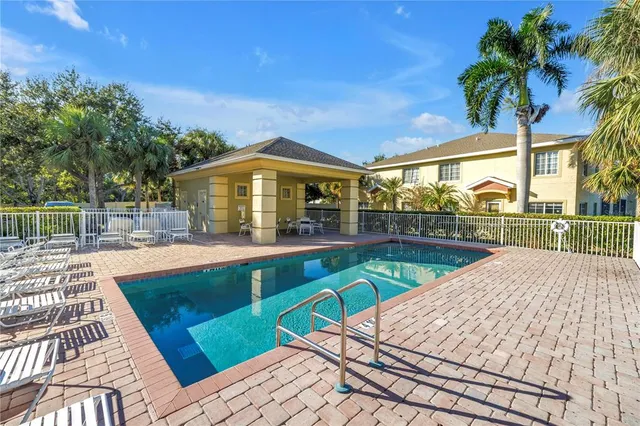 a view of a swimming pool with a patio