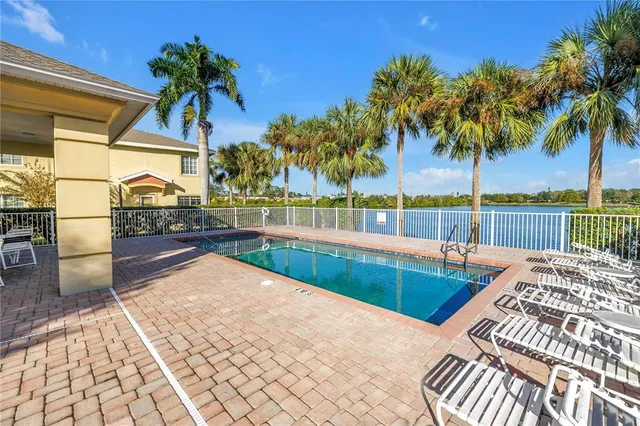 a kitchen with granite countertop cabinets stainless steel appliances and a window