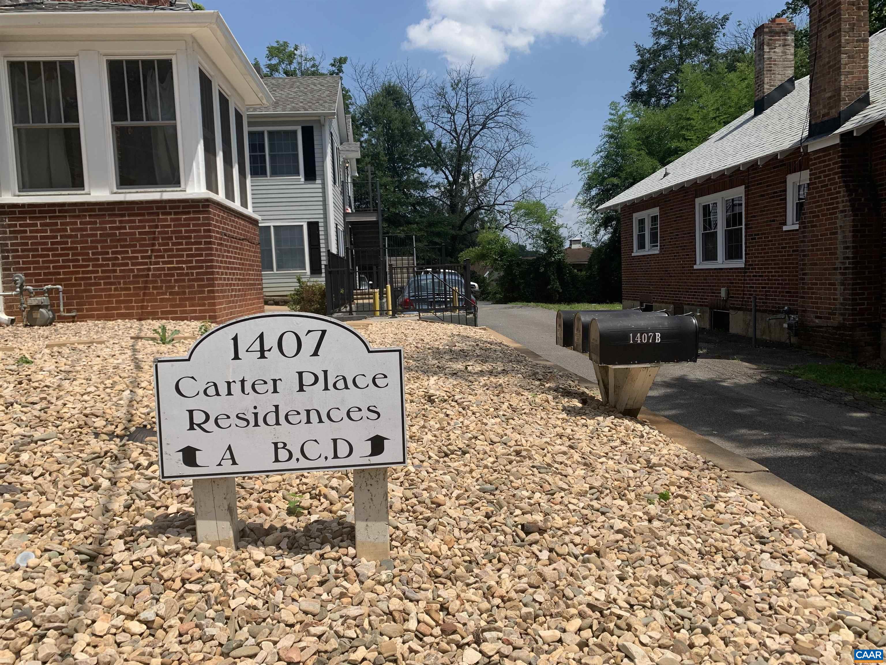 1407 Grady Avenue, Unit D Charlottesville, VA 22903 - Photo 14 of 14 a sign on the side of a building