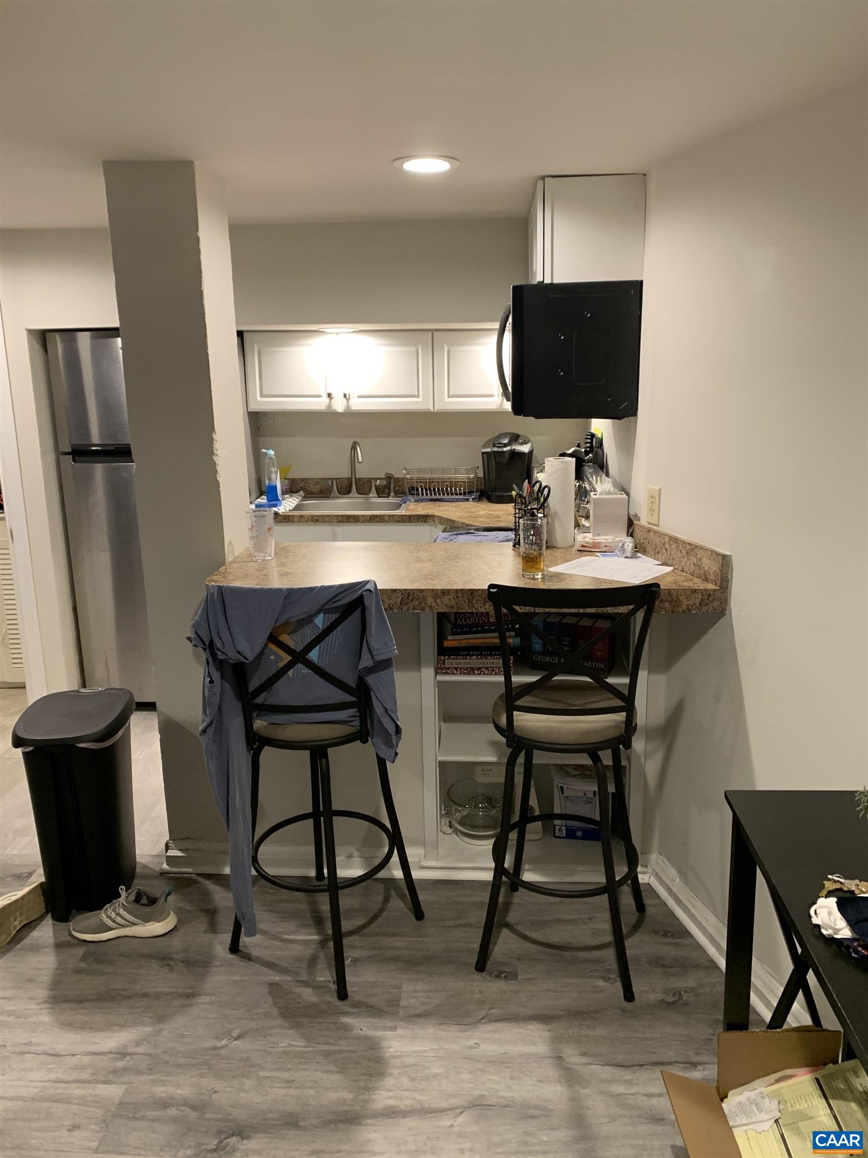 1407 Grady Avenue, Unit D Charlottesville, VA 22903 - Photo 5 of 14 a view of a workspace with furniture and a flat screen tv