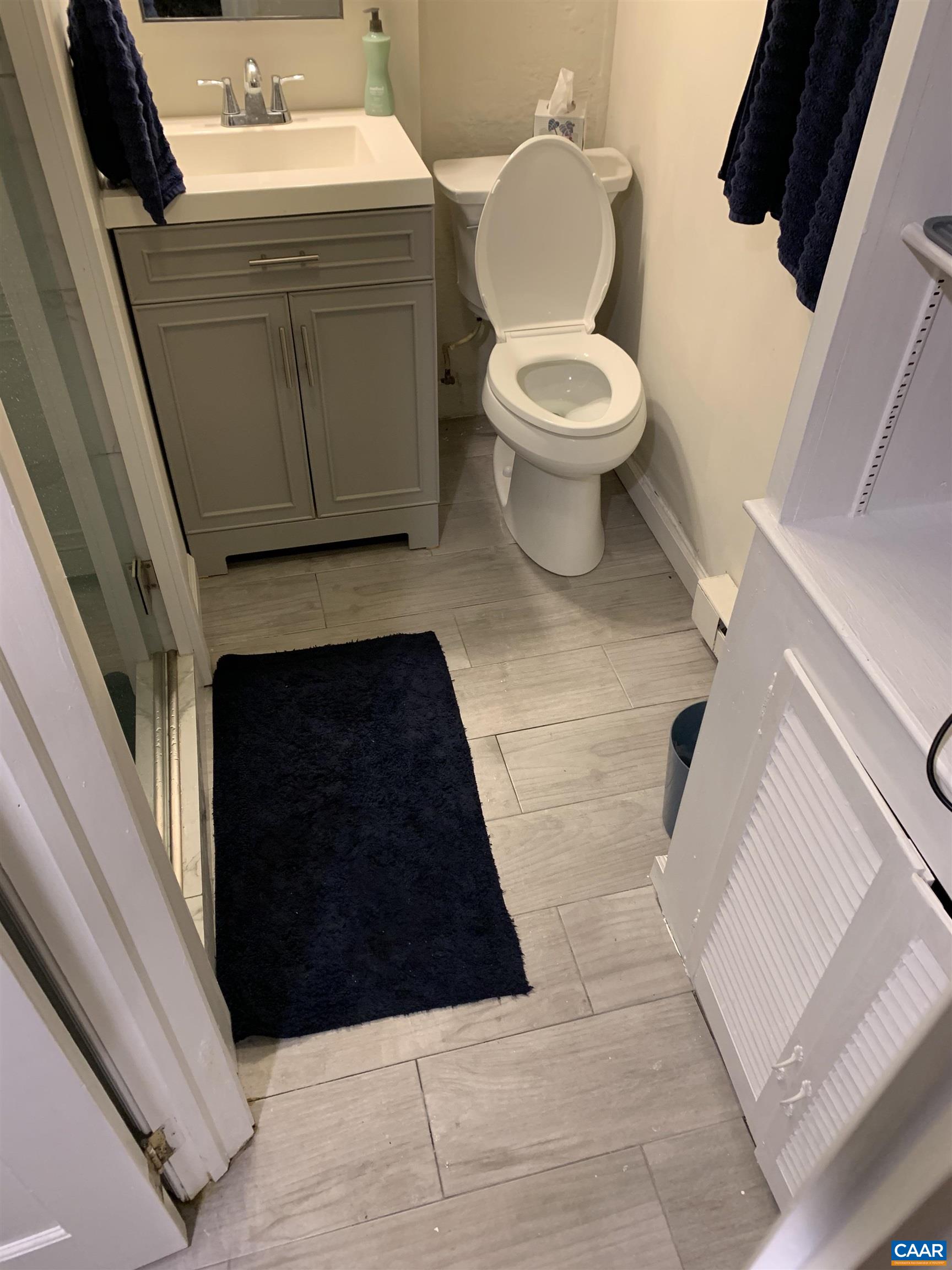 1407 Grady Avenue, Unit D Charlottesville, VA 22903 - Photo 10 of 14 a bathroom with a toilet and a sink