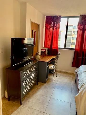 a room with furniture and a flat screen tv