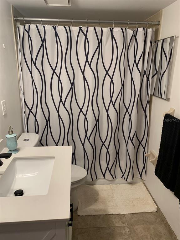 3006 Caring Way, Unit 417 Port Charlotte, FL 33952 - Photo 18 of 24 a bathroom with a sink and a mirror