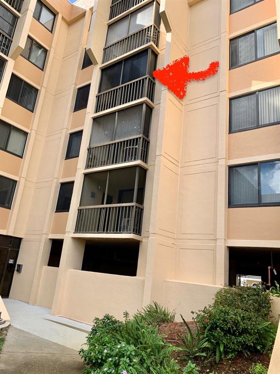 3006 Caring Way, Unit 417 Port Charlotte, FL 33952 - Photo 21 of 24 a view of building with large windows