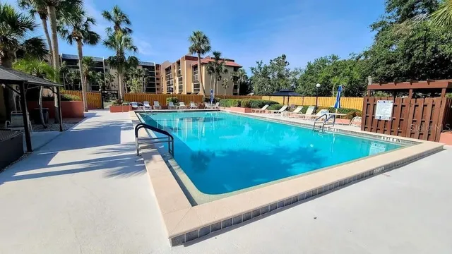swimming pool view with a outdoor seating space
