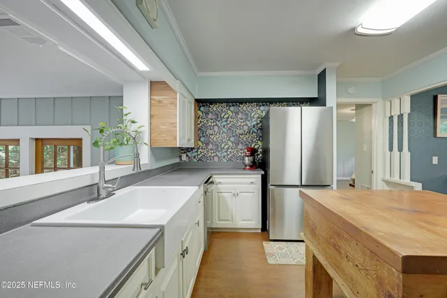 a view of walk in closet and bathroom