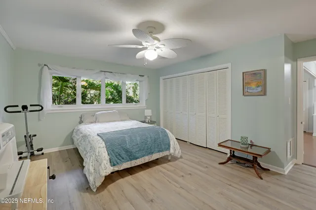 a living room with furniture and a mirror