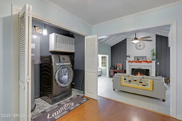 a front view of house with yard and trees