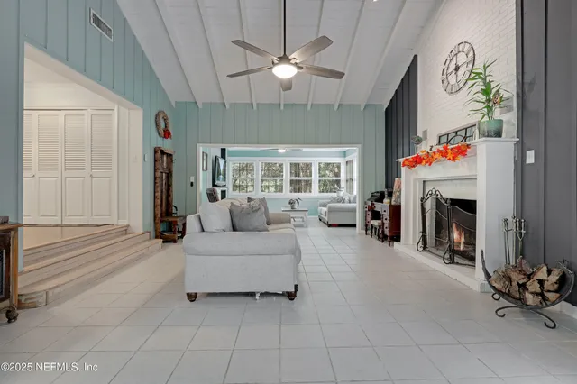 a view of a grassy field with trees