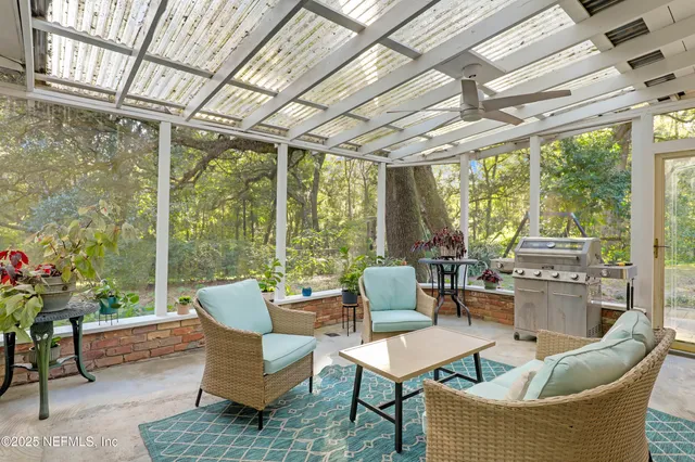 a view of a yard with wooden fence