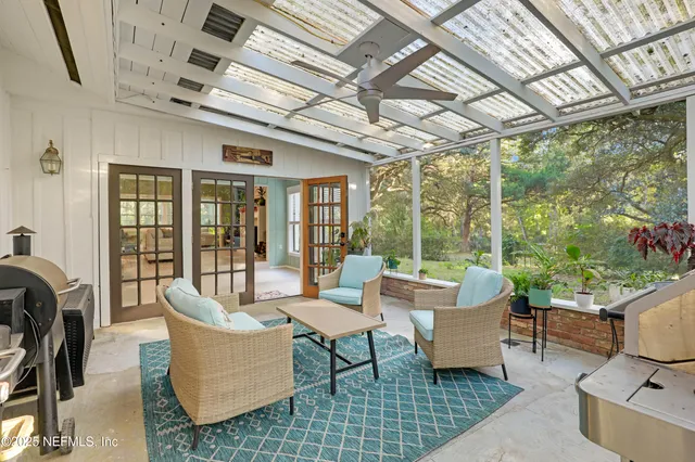 a view of a yard with a plants and trees